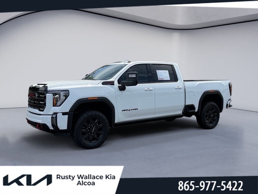 2024 GMC Sierra AT4 in Summit White — front three-quarter view