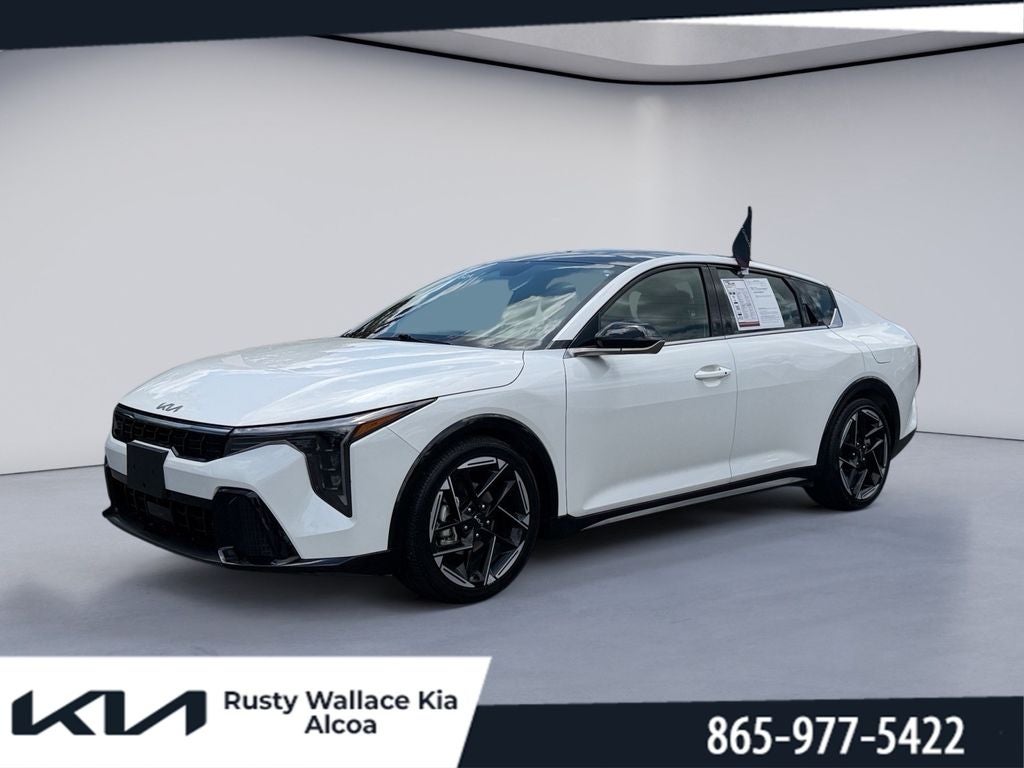 2025 Kia K4 GT-Line in Snow White Pearl — front three-quarter view