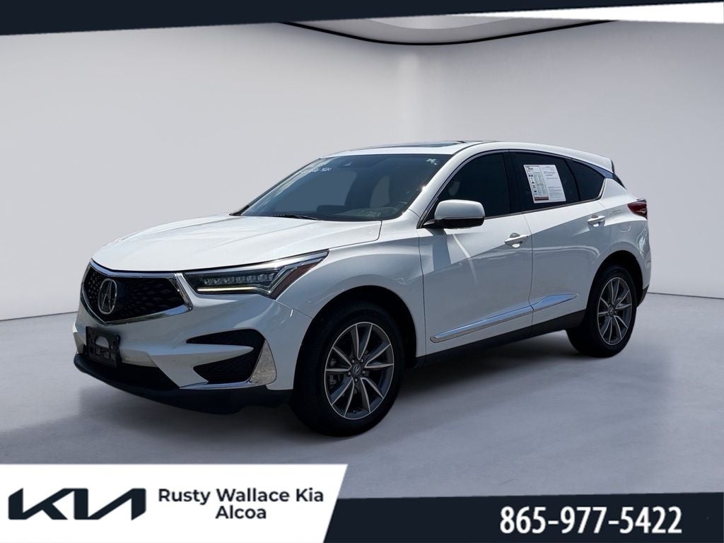 2020 Acura RDX w/Technology Pkg in Platinum White Pearl — front three-quarter view