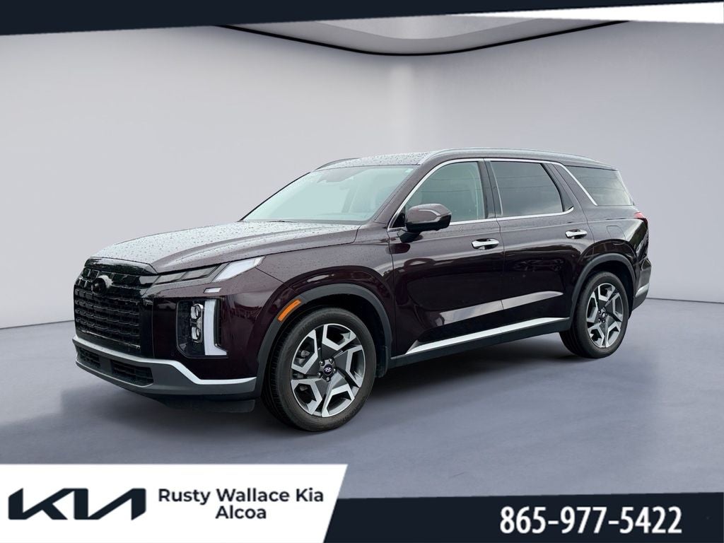 2024 Hyundai Palisade SEL 7P in Sierra Burgundy — front three-quarter view