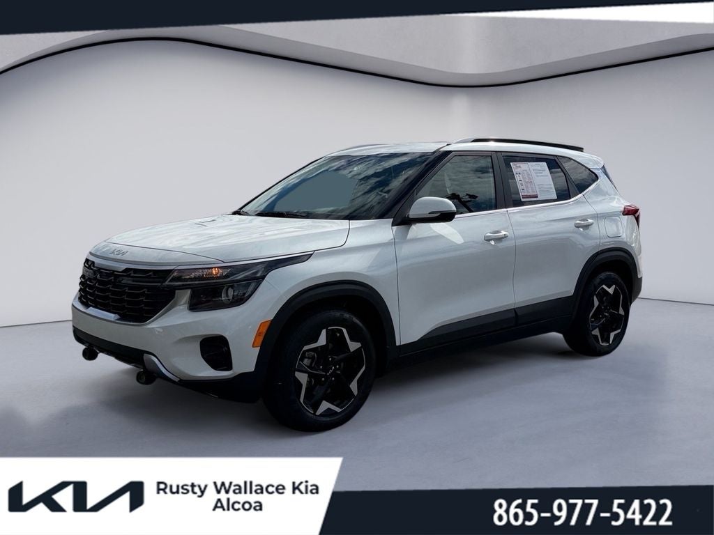 2024 Kia Seltos EX in Snow White Pearl — front three-quarter view