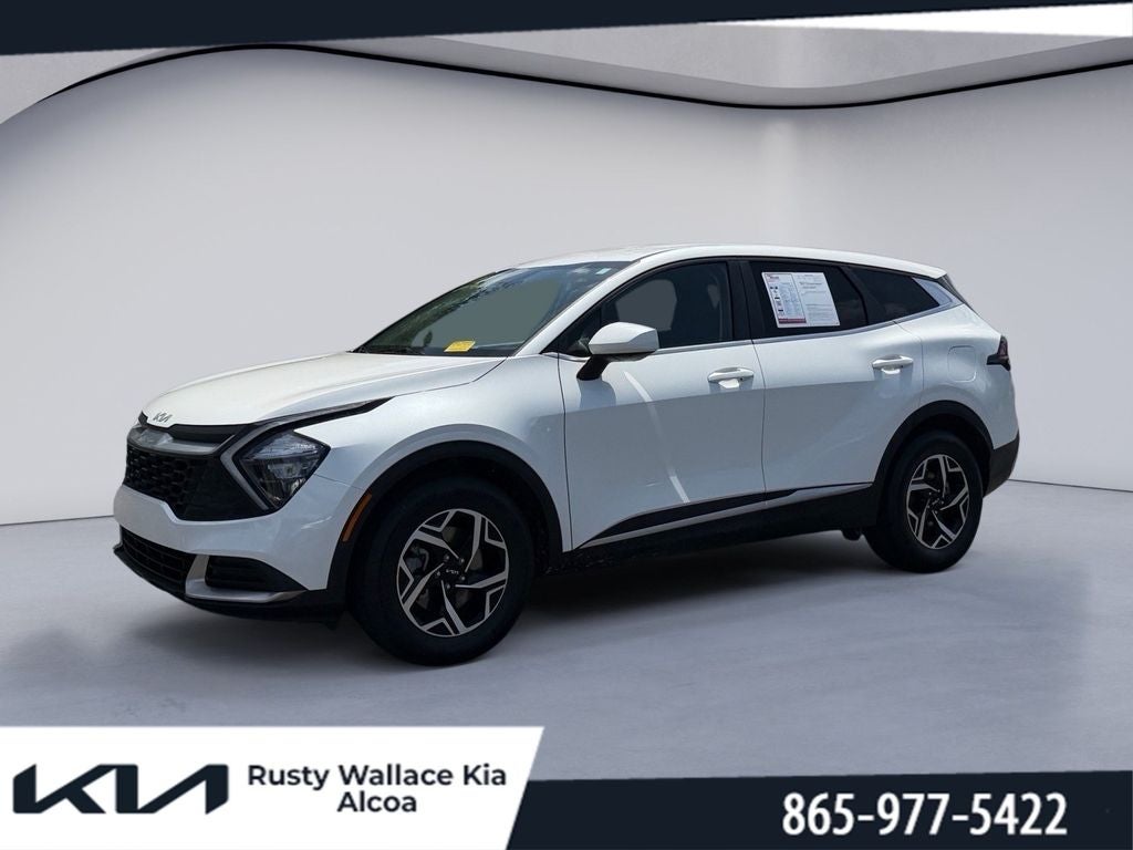 2023 Kia Sportage LX in Snow White Pearl — front three-quarter view