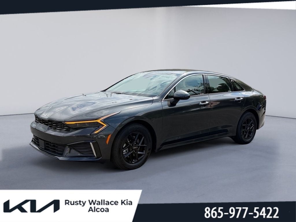 2025 Kia K5 LXS in Interstellar Gray — front three-quarter view
